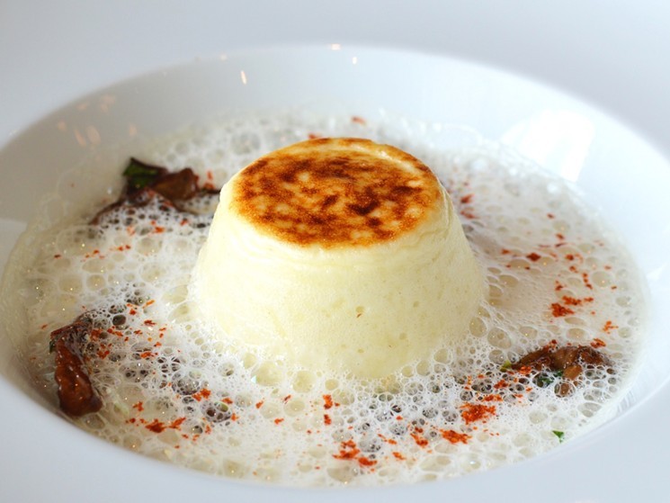 Start with a caramelized cheese soufflé with parmesan foam at La Table. - PHOTO BY MAI PHAM