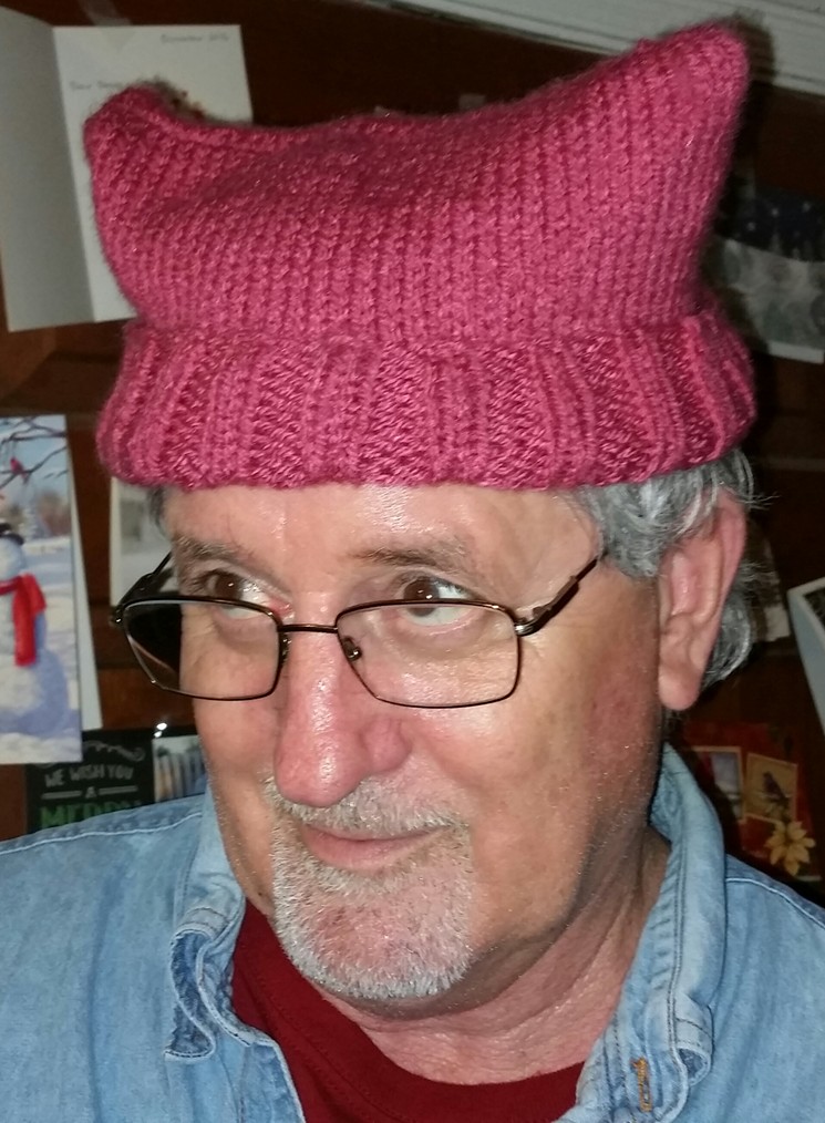 Tons of women (and men) bought this nifty little hat to show their support of the Womens's March. - PHOTO BY RANDAL BYRD