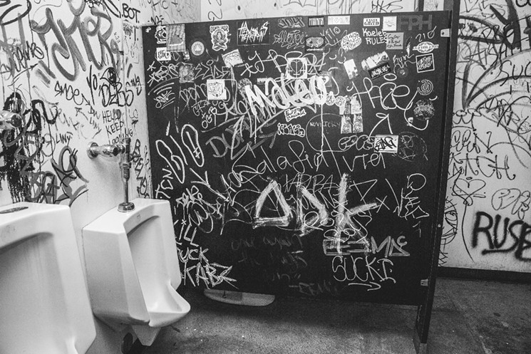The Men's room graffiti. - PHOTO BY DEREK RATHBUN