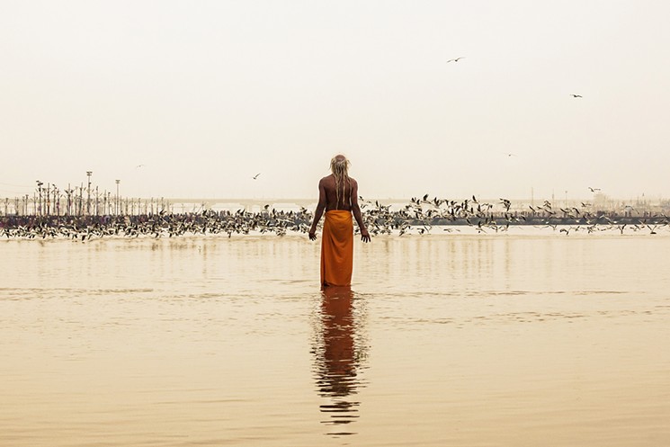 Every 12th year, millions of devoted pilgrims attend the world's largest spiritual pilgrimage, India's Kumbh Mela, at the confluence of three holy rivers. Greg Davis photographed the event and directed a short film, Cloth Paper Dreams. - PHOTO BY GREG DAVIS, COURTESY OF G SPOT CONTEMPORARY
