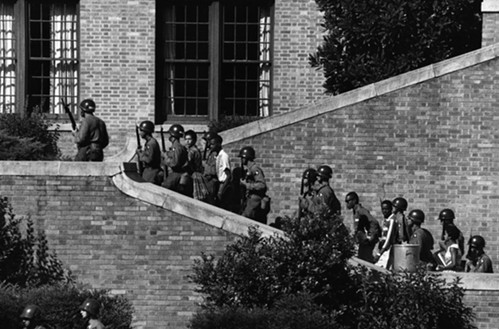 Soldiers of the 101st Airborne escort black students into Little Rock High School, September 1957. - PHOTO COURTESY OF SIMON & SCHUSTER