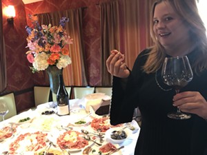 Mary Clarkson, owner of L'Olivier, enjoys the generous spread of cured meats. - PHOTO BY KATE MCLEAN