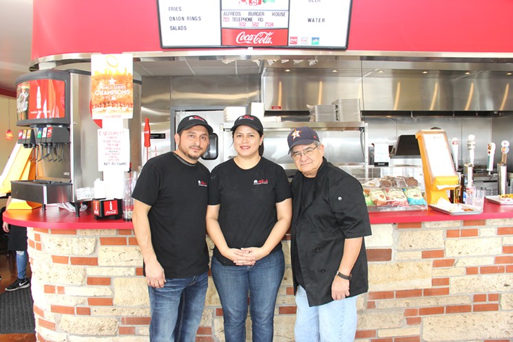 Alfredo Lopez, Janie Lopez, and Albert Gomez at the counter of Alfred's Burger House - PHOTO BY DOOGIE ROUX