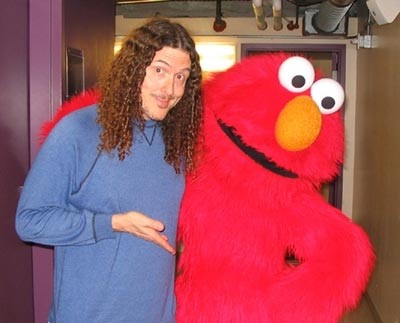 Yankovic in a seedy backstage area with one of his many show biz friends. - COURTESY OF WEIRDAL.COM