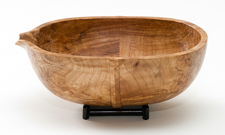 Thomas Irven created this Pour Bowl out of ebony and maple burl, turning the piece then cutting it in half and gluing both halves back together with their lids to form an oblong bowl before finishing it with a spout. - PHOTO COURTESY OF THE ARTIST AND ARCHWAY GALLERY