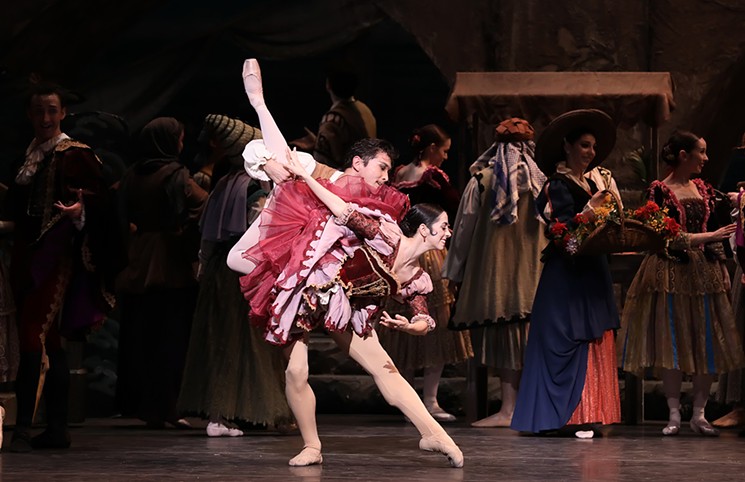 Soloist Mónica Gómez and principal Charles-Louis Yoshiyama with artists of Houston Ballet in Don Quixote. Gómez will dance the role of Kitri on May 12, first soloist Soo Youn Cho dances on May 11 and first soloist Allison Miller on May 13. - PHOTO BY AMITAVA SARKAR
