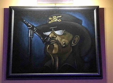 One of Voros' favorite items of decor is this velvet painting of Lemmy from Motorhead. Warts and all. - PHOTO BY BOB RUGGIERO