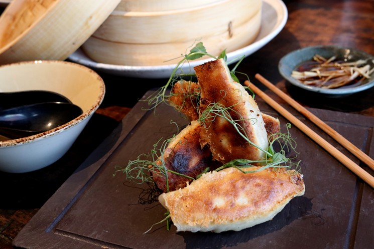 Pan fried dumplings are meant to be shared...or not. - PHOTO COURTESY OF IZAKAYA