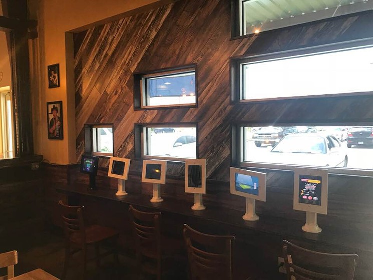 This iPod wall will keep 'em occupied while parents sip on those adult milkshakes. - PHOTO BY JENNIFER FULLER
