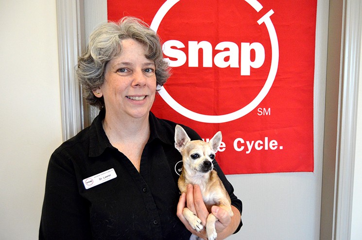 Jalapeño the pup is in good hands with Mary Kate Lawler, DVM, Spay-Neuter Assistance Program's executive director. - PHOTO COURTESY OF SPAY-NEUTER ASSISTANCE PROGRAM, INC.