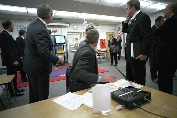 President George W. Bush watches news footage from Emma E. Booker Elementary School in Sarasota, Florida, of Flight 175 hitting the south tower of the World Trade Center on September 11, 2001. - PHOTO COURTESY OF THE GEORGE W. BUSH PRESIDENTIAL LIBRARY AND MUSEUM