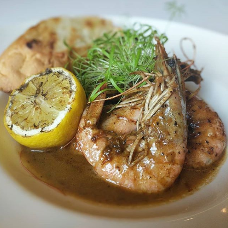 Brennan's Nola-style BBQ shrimp is on special Fridays in July. - PHOTO COURTESY OF BRENNAN'S OF HOUSTON