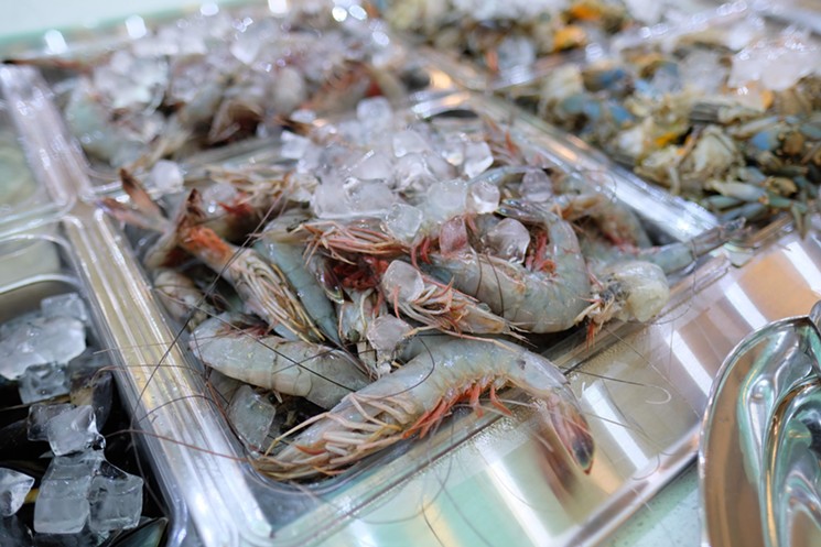Seafood selections include large prawns (pictured), white fish, calamari, blue crabs and  more. - PHOTO BY MAI PHAM