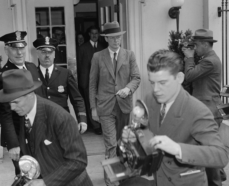 Famed aviator Charles Lindbergh (in hat), put himself in the middle of the debate over intervention in the war. His trips to Germany and involvement with the America First Committee would make him one of Hitler's key American "friends." He's seen here leaving the White House after a tense meeting with President Roosevelt on April 20, 1940. - HARRIS & EWING COLLECTION: LIBRARY OF CONGRESS/COURTESY OF THOMAS DUNNE BOOKS