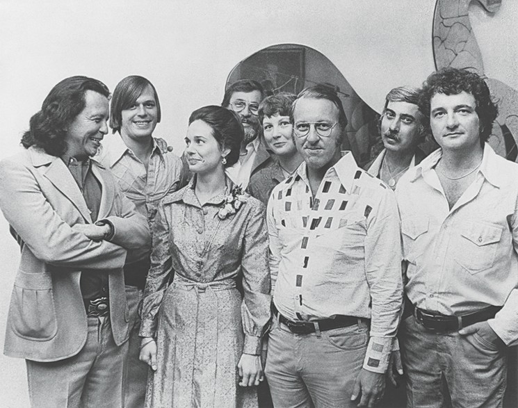 Read more about these art pioneers in Collision. Shown: Fritz Scholder, Lucas Johnson, Betty Moody, Charles Pebworth, Victoria Andrews, Arthur Turner, Stanley Lea and Lamar Briggs at the inaugural opening of Moody Gallery in 1975. - PHOTO COURTESY OF MOODY GALLERY