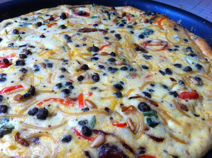 Pasta frittata with parm, arugula, tomatoes, shallots, capers, pine nuts, chiles, lemon zest. - PHOTO BY NICHOLAS L. HALL