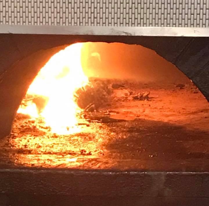 It's not the mouth of Hell. It's a wood-burning oven. - PHOTO COURTESY OF K.AURA'S KITCHEN