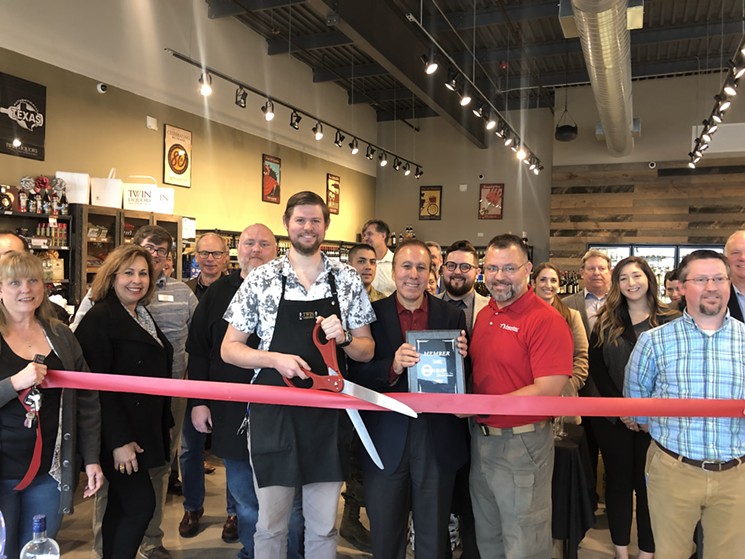 Smiling faces and ribbon cutting at the new Twin Liquors in Spring. - PHOTO COURTESY OF TWIN LIQUORS