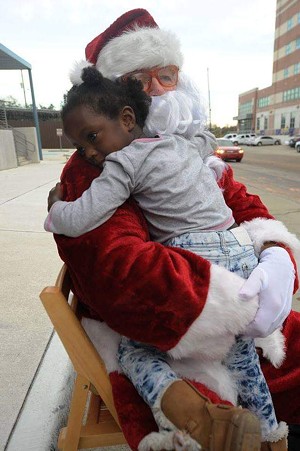 Christmas at the Jail 6 brings hugs and smiles. - PHOTO BY DAVID ATWOOD