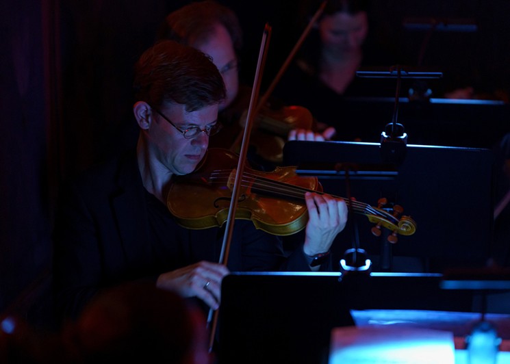 Jonathan Godfrey, Mercury’s concertmaster, has several solos in Flowers of Evil, a new impressionist opera that features original orchestrations by Antoine Plante. - PHOTO BY RUNAWAY PRODUCTIONS