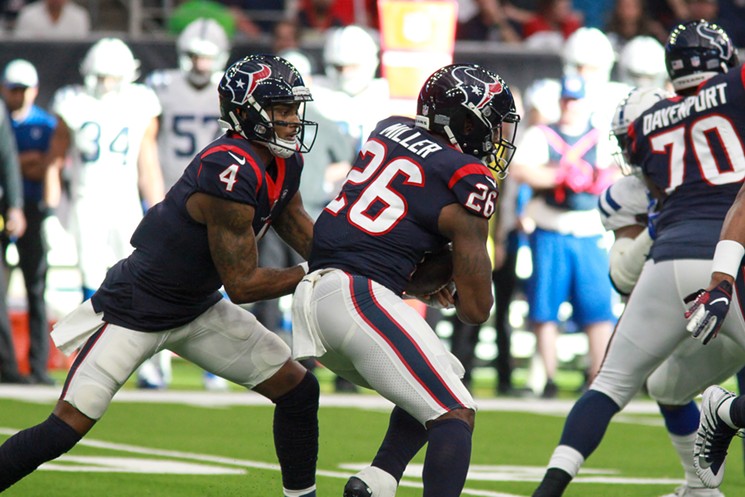 This was a rare sight — a handoff to a Texans running back. - PHOTO BY ERIC SAUSEDA