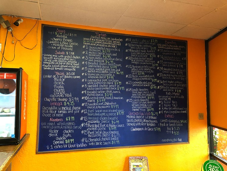 The massive chalkboard menu is filled with more than two dozen varieties of torta. - PHOTO BY JEFF BALKE