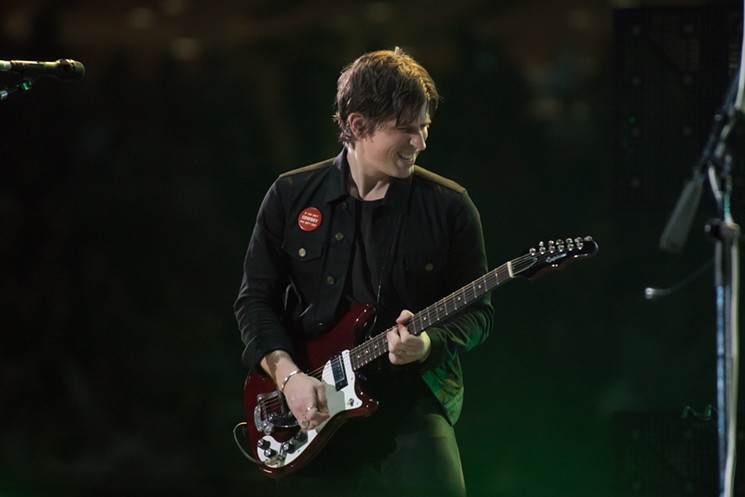 Matthew Followill delivered a number of impeccable guitar solos with Kings of Leon last night at RodeoHouston. - PHOTO BY JACK GORMAN
