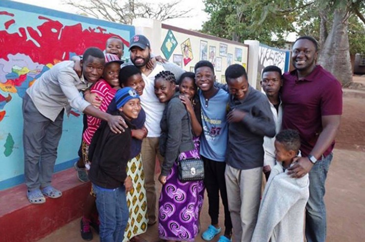 Jamar Simien (in the ballcap fourth from left), calls this the "best day" of his life. - PHOTO BY LUC DESCHAMPS, EXECUTIVE DIRECTOR OF THE JACARANDA SCHOOL FOR ORPHANS