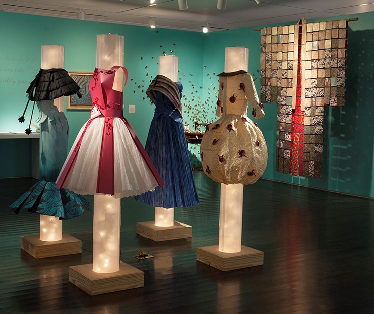 "Paper Couture" is an installation of retro-inspired fashions by origami artis, Joan Son, based upon her original paper doll dress designs from 1958. It's on view at The Printing Museum June 7-December 22. - PHOTO BY THE PRINTING MUSEUM