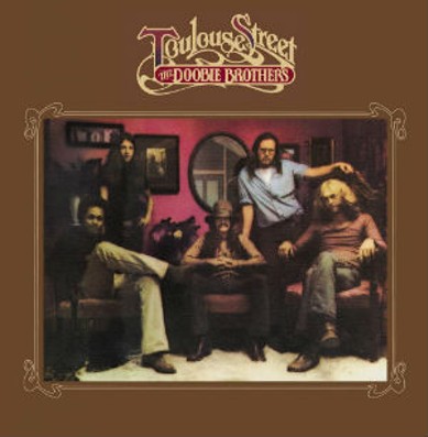 The cover of 1972's Toulouse Street - shot in a former New Orleans bordello - featured the then lineup Tiran Porter, Patrick Simmons, Tom Johnston (seated), John Hartman, and Michael Hossack. - WARNER BROTHERS ALBUM COVER