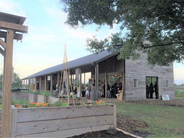 Guests mingle in the Gathering Barn at Hope Farms. - PHOTO BY LORRETTA RUGGIERO