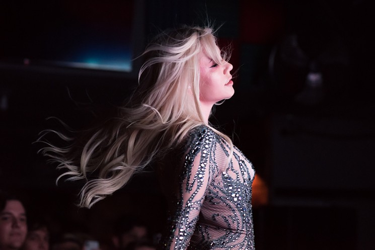 Slayyyter spins on stage at the Satellite Bar during her 2019 Mini Tour. - PHOTO BY JACK GORMAN