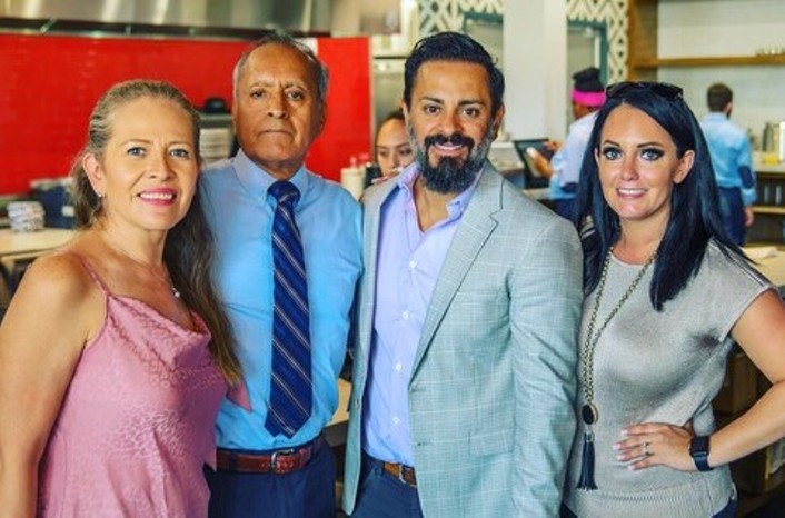 Owners Julio and Amber Garcia (on the right) celebrate the soft opening of  Ambriza's Cypress location. - PHOTO BY JAMES KAATZ/ILLUMINATION MARKETING