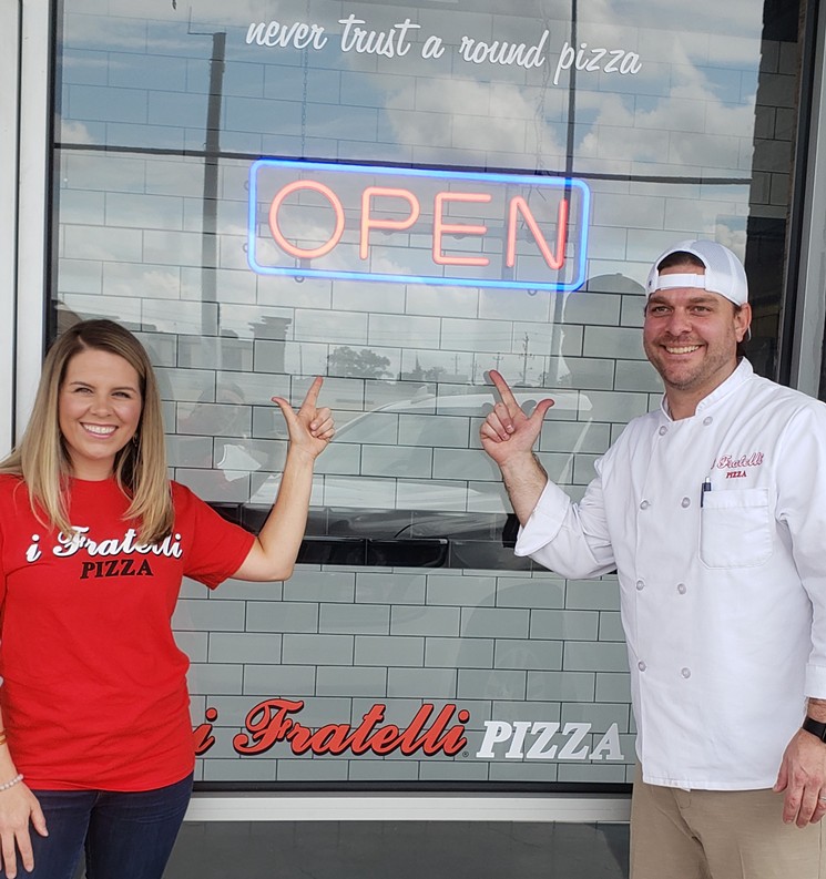 Callie and Bruce Redden are ready to deliver i Fratelli pizza to Houston. - PHOTO BY CHUCK BALLARD