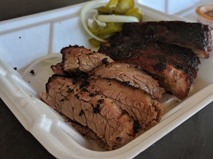 Brisket is tender and juicy, but lacks smoke and color. - PHOTO BY CARLOS BRANDON