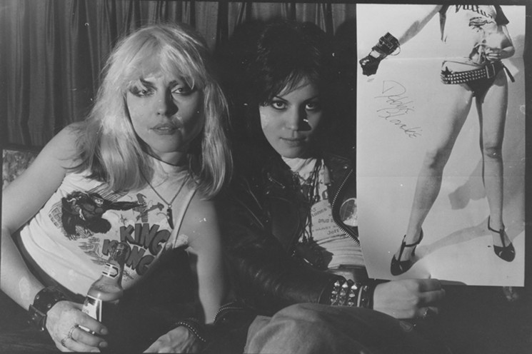 Debbie Harry and fellow rocker Joan Jett with the famous "Blondie" poster of the era. - PHOTO BY CHRIS STEIN/COURTESY OF DEY STREET BOOKS