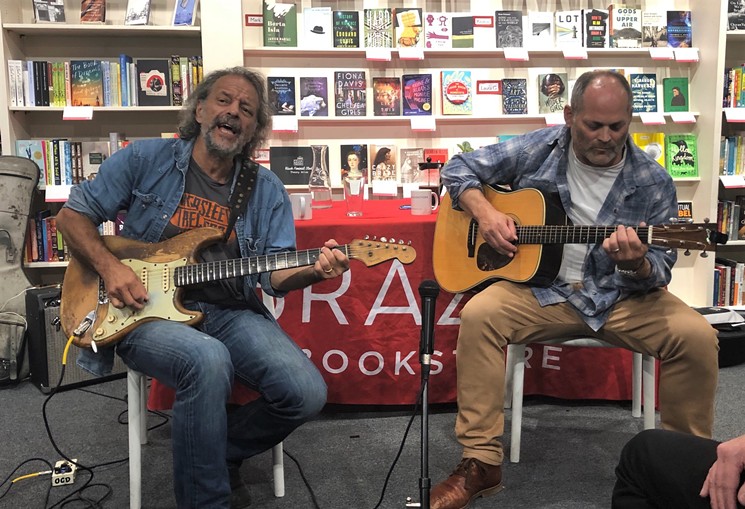 Andy Aledort and Alan Paul play some Stevie Ray Vaughan music during their August appearance at Brazos Bookstore. - PHOTO BY BOB RUGGIERO