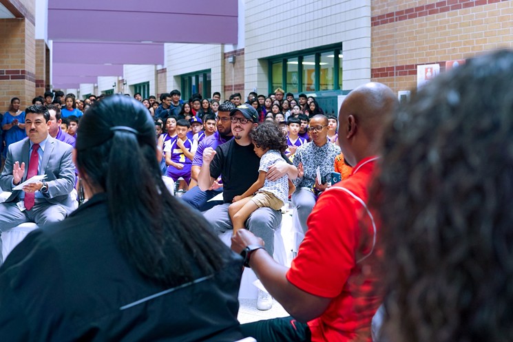 Serrano (center) in 2018 at Stevenson Middle School, where he once worked as a teacher and coach. - PHOTO BY MARCO TORRES