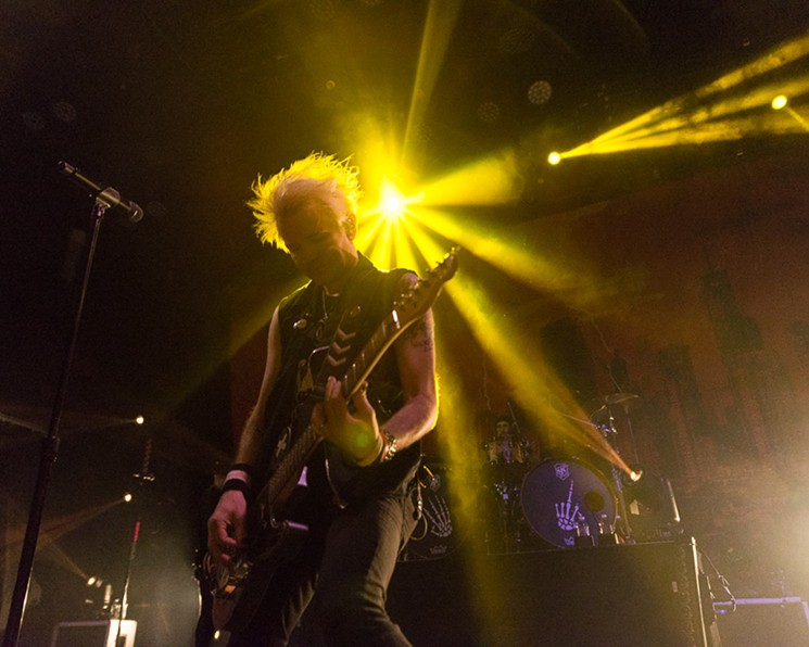 Light beams down on lead singer Deryck Whibley of Sum 41. - PHOTO BY JENNIFER LAKE