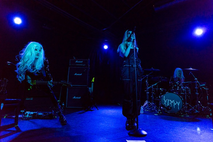Guitarist Aaron Deming, singer Poppy, and drummer Sam Palombo performing at Warehouse Live. - PHOTO BY JENNIFER LAKE