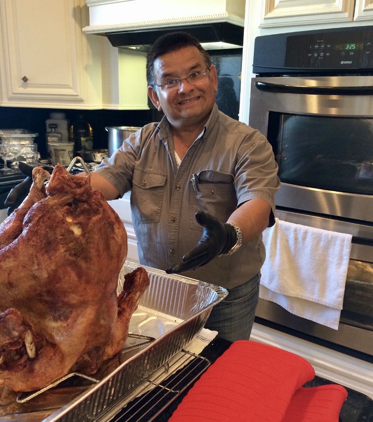 How do you say no to a lovable dad proudly presenting his deep fried turkey? - PHOTO BY NICOLE VALADEZ