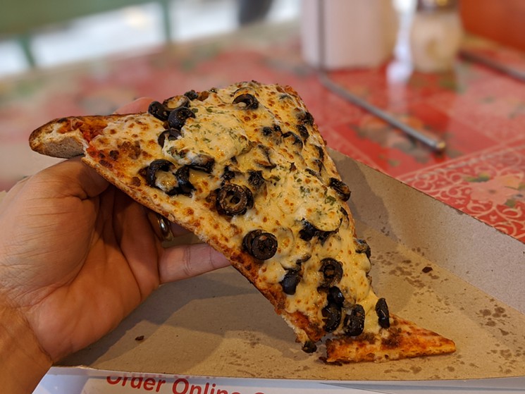 Ground beef, black olives and ricotta cheese from Pink's Pizza - PHOTO BY CARLOS BRANDON