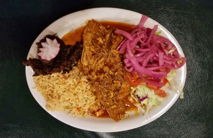 Cochinita Pibil is a Yucatan classic pulled pork dish slow cooked with the Annato seed that is native to the Mayan region of Mexico. - PHOTO BY ADÁN MEDRANO