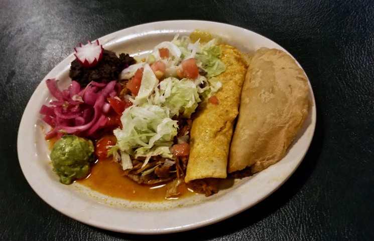Yucatan combination plate: beef empanada; cochinita pibil taco; panucho; salbute with salad; pickled red onions; fried black beans and guacamole. - PHOTO BY ADÁN MEDRANO