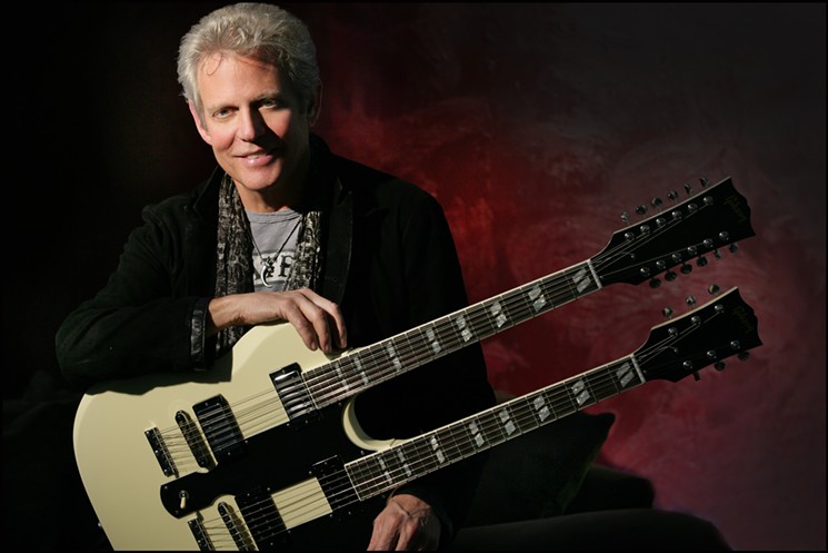 Don Felder with one of his signature white Gibson double necked guitars. - PHOTO BY MICHAEL HELMS/COURTESY OF ABC-PR