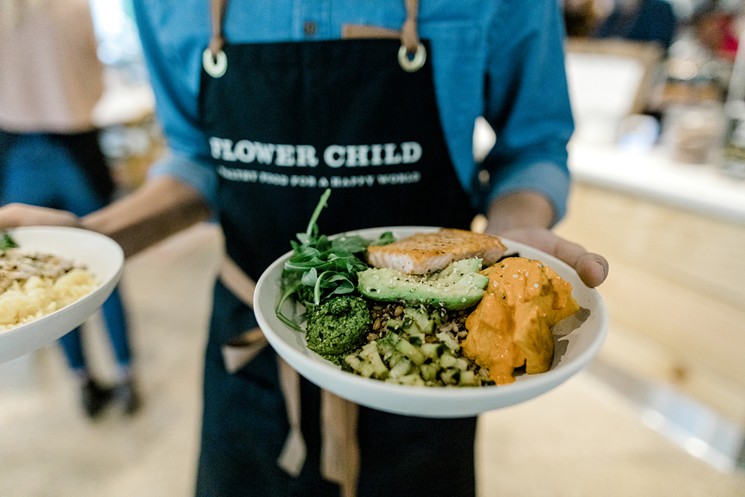 Healthy food served by healthy servers at Flower Child. - PHOTO BY FLOWER CHILD