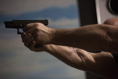 “Guns? I love ’em!,” said church member David Colbath, after a bullet blasted a hole through his right forearm. - PHOTO LISA KRANTZ-SAN ANTONIO EXPRESS-NEWS/COURTESY OF HACHETTE BOOKS