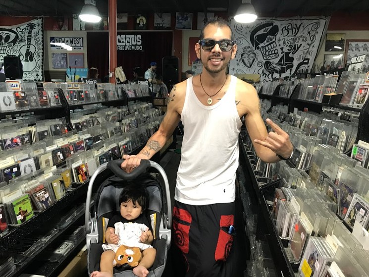David Rodriguez and his young music fan, Liam - PHOTO BY JESSE SENDEJAS JR.