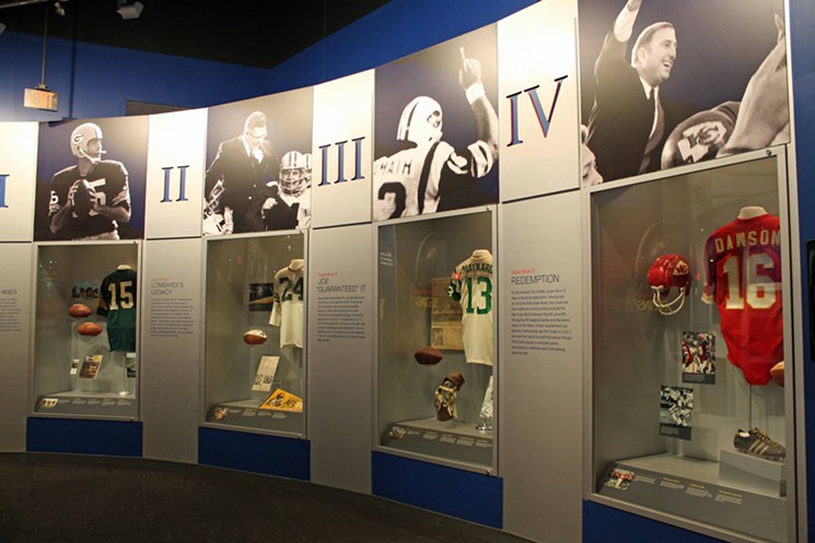 The Hall has a lot of memorabilia including these Super Bowl worn jerseys, game footballs, and artifiacts. - PHOTO BY BOB RUGGIERO