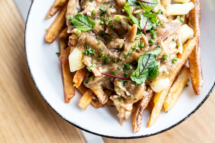 Duck Confit Poutine is a thing at Local Group Brewing. - PHOTO BY CARLA GOMEZ